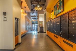 an empty hallway with lockers in a building at Seattle Lux 1 bd Apartment- Rooftop, WiFi, Pet Friendly in Seattle