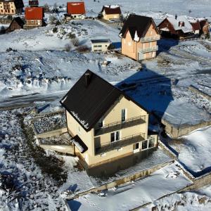 an aerial view of a house in the snow at Vikendica Jadranka in Kupres