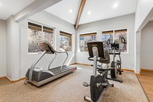 a gym with two exercise bikes and treadmills at Wolf Lodge 510 in Eden