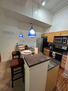 a kitchen with a island with a counter top at Charming 2Bd/2bth Retreat in Downtown Richmond in Richmond