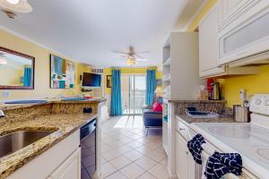 a kitchen with a sink and a counter top at Makai 404 in Ocean City