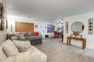 a living room with a couch and a table at Centrally Located Apt about 2 Mi to University of Iowa in Iowa City