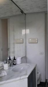 a bathroom with a sink and a mirror at Villa Bianca in Massa Lubrense