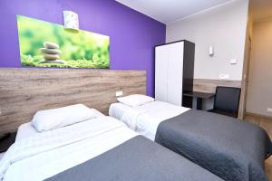 Postel nebo postele na pokoji v ubytování Hotel City Center