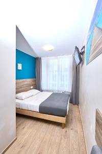 Postel nebo postele na pokoji v ubytování Hotel City Center