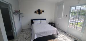 Postel nebo postele na pokoji v ubytování 2 PALMAS STR + 37 fotografií