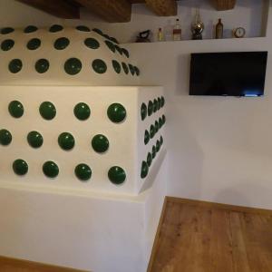 a room with a bunch of green balls on the wall at Beim Bergbauer in Fischbach