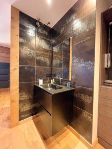 a bathroom with a sink and a wall at La belle grange in Mercury +34 photos