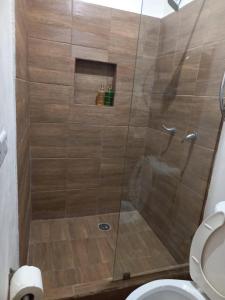 a shower with a glass door in a bathroom at Casa Naty in Ciudad Valles