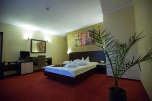 Postel nebo postele na pokoji v ubytování Hotel Meliss