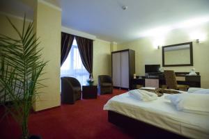 Postel nebo postele na pokoji v ubytování Hotel Meliss