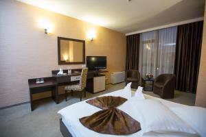 TV a/nebo společenská místnost v ubytování Hotel Meliss