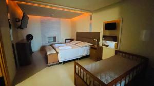 Ένα ή περισσότερα κρεβάτια σε δωμάτιο στο Espaço Nobre +84 φωτογραφίες