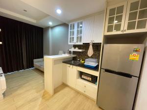 a kitchen with a refrigerator and a counter top at Easy Easy @ the patio in Ban Bang Saen (1)