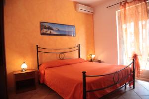 Postel nebo postele na pokoji v ubytování Residenza La Vigna + 37 fotografií