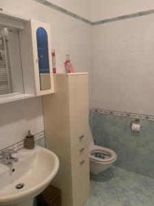 a bathroom with a sink and a toilet at Grazioso appartamento a Osteria Nuova in Sala Bolognese