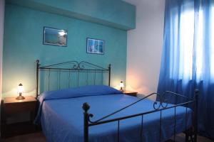 Postel nebo postele na pokoji v ubytování Residenza La Vigna