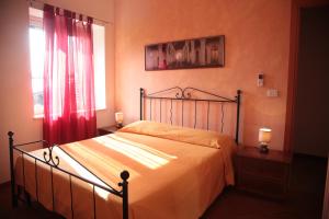 Postel nebo postele na pokoji v ubytování Residenza La Vigna