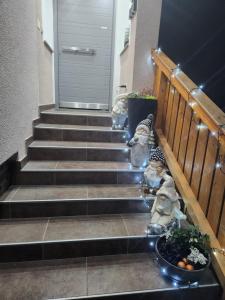 a set of stairs with a door and a bowl of fruit at Vila Rajska ptica in Bled