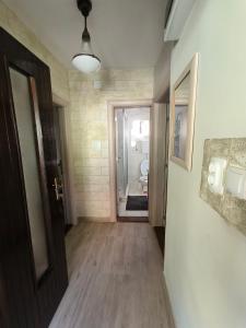 an empty hallway with a door and a bathroom at Apartman - GOLEMI MOST in Pirot