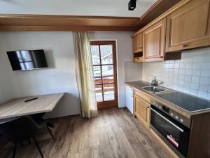 Kuchyň nebo kuchyňský kout v ubytování Apartment Steinbock + 18 fotografií