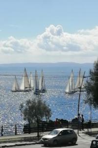 a car parked in front of a body of water with sailboats at Venere B&B in Catania