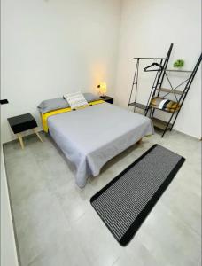 a bedroom with a bed and a black rug at La Ventana Apartments View Island #4 in La Ventana