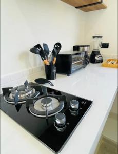 a kitchen counter with a black stove top oven at La Ventana Apartments View Island #4 in La Ventana