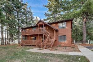 a home with a large deck and a staircase at Piers and Pines at Island Pointe in Wisconsin Dells