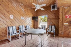 a dining room with a table and chairs in a cabin at Family Dreams - Lakefront, 2-bedroom, multi-level condo, Winter Vacation in Wisconsin Dells