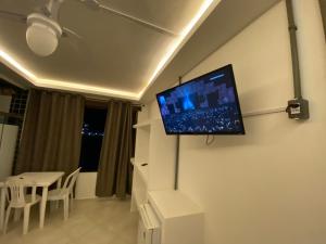 TV in/ali zabaviščno središče v nastanitvi Rosa dos Anjos