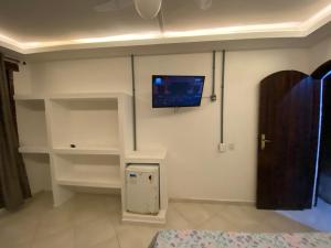 TV in/ali zabaviščno središče v nastanitvi Rosa dos Anjos