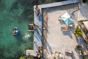 an overhead view of a beach with people in the water at Santa Lova Eco-hostel Isla Tintipan in Tintipan Island