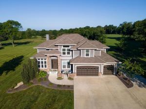 an aerial view of a house with a driveway at Luxe Missouri Getaway with Hot Tub and Fire Pit! in Oak Grove