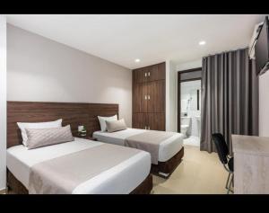 Voodi või voodid majutusasutuse Hotel Elite toas