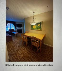 a living room with a dining room table and chairs at Vacation Village in The Berkshires in Hancock