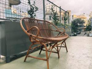 a wooden bench sitting on top of a building at Charming Heritage 2 BR In Mar Mikhael in Beirut