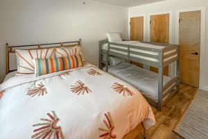 a bedroom with a bunk bed and a desk at Mountainside 70 in Warren