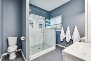 a bathroom with a shower and a toilet and a sink at Water Well Wonder in Austin +36 photos