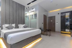 Letto o letti in una camera di GTA HOTEL IKEJA