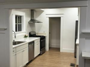 a kitchen with a sink and a stove top oven at USC University Koreatown Olympic Pico in Los Angeles