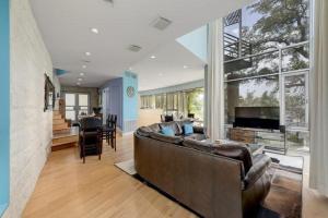 a large living room with a couch and a television at Overlook Landing in Buffalo Gap