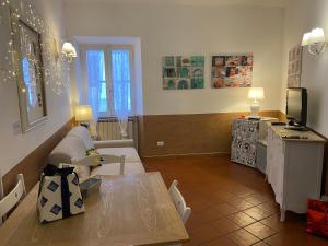 a living room with a couch and a table at Navona "The Corner" in Rome