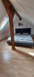 a bedroom with a bed in a attic at Zentrale Altbauwohnung mit Flair in Schwäbisch Hall