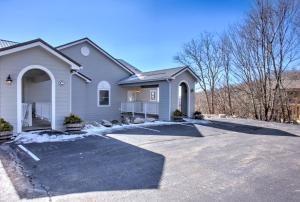 a house with a driveway in front of it at Carolina North by VCI Real Estate Services in Beech Mountain