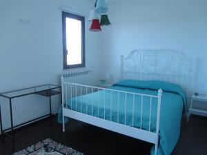 Krevet ili kreveti u jedinici u okviru objekta Oltremare Rent Rooms