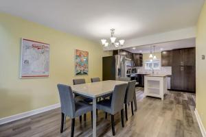 a dining room and kitchen with a table and chairs at Destination Dells II at Tamarack Resort in Wisconsin Dells