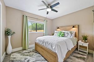 a bedroom with a bed and a ceiling fan at Saloma Place in Austin