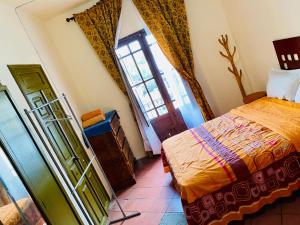 Postel nebo postele na pokoji v ubytování Hostal Santuario de las Libelulas