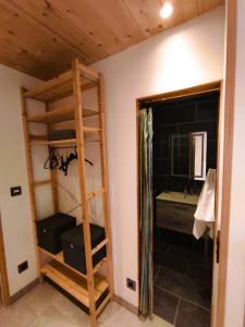 a bedroom with a bunk bed and a bathroom at Studio Sainte Marie in Lanslebourg-Mont-Cenis